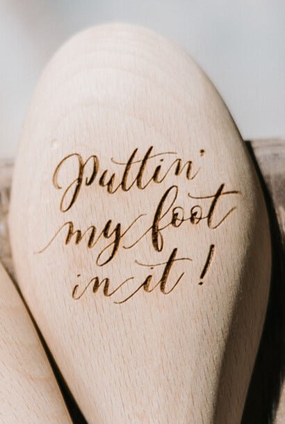 Wooden spoon with Puttin’ My Foot In It design