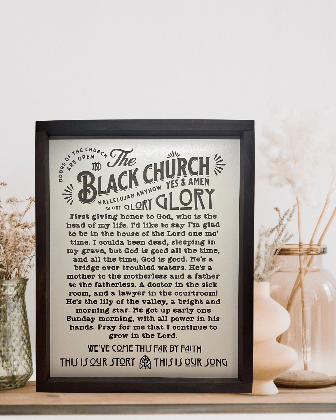 Framed Black Church wall art displayed on shelf